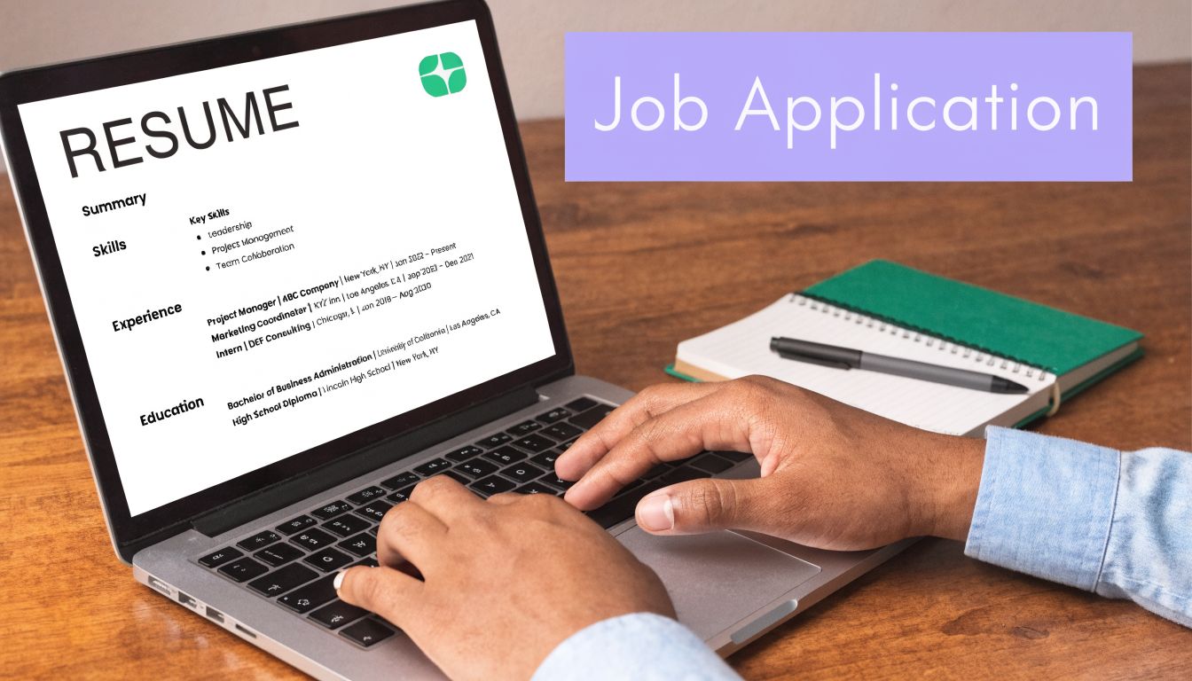 A person typing a resume on a laptop computer to apply for a job online.